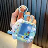 Llavero de Oso de Dibujos Animados Juguete Máquina de Garra Juguete de Dibujos Animados Exquisito Llavero Colgante para Mochila Escolar Pequeño Regalo