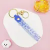 Llavero Colgante de Cordón de Cuero con Letra Transparente Brillante con Accesorios Estilo Muñeca Rellena de Aceite Encanto de Llavero Pulsera Venta al por Mayor