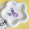 Colgante pequeño de resina con forma de cara sonriente de color caramelo coreano, bonito llavero para bolso de hombre y mujer, colgante para auriculares.
