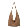 Bolsa de playa tejida hueca de estilo dulce de nicho nuevo para mujer 2026, bolsa de hombro de gran capacidad de estilo casual y perezoso
