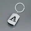 Llavero de Acero Inoxidable con Letra Inglesa Hueca Pulida 26 Simple y Personalizado Colgante para Mochila Coche