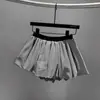 Saia-short bufante estilo coreano com estampa de flor de nuvem botão para mulheres verão 2025 nova cintura alta emagrecedora plissada irregular meia-saia