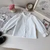 Conjunto de Tres Piezas para Niña Primavera y Otoño 2026, Nueva Camisa de Manga Larga Estilo Coreano, Chaleco de Punto con Encaje y Falda para Venta Transfronteriza