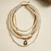 Collar de perlas en capas con cuentas transfronterizo europeo y americano, cadena para la clavícula estilo fiesta vintage, lujo ligero, accesorio versátil de alta gama para mujer