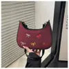 Nova bolsa de ombro com laço de tecido fosco vintage para axila, bolsa de ombro colorida bordada de nicho, bolsa transversal diária para mulheres