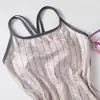 Trajes de baño para mujer al por mayor, modelo nuevo 2026, bañador de una pieza conservador para damas con copas en el pecho, adecuado para piscinas y aguas termales, traje de baño de natación