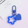 Llavero con hebilla de puerta giratoria, colgante de pentagrama y corazón transparente de colores, accesorio hecho a mano para bolsos
