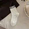 Calcetines de lunares Melard para mujer, estilo retro francés de primavera y otoño, calcetines de media pantorrilla con etiqueta de tela de contraste de color, combinados con zapatos pequeños de cuero