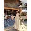 Un Vestido Largo Estilo Princesa Yikett de Color Melocotón Dulce con un Ambiente de Verano, Estilo Vacacional, Diseño Adelgazante y Color Blanco