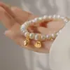 Cuentas redondas de cristal rosa, pulsera de flor de cuentas de cristal de colores y perlas, sensación de lujo ligero de alta gama, accesorio de mano versátil vintage