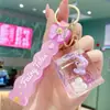 Nuevo Llavero Anillo de Botella con Muñeca de Arena Líquida, Colgante Exquisito de Dibujos Animados para Mochila para Niñas y Niños, Accesorio de Pareja, Pequeño Regalo para Eventos