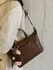 Bolsa transversal de design nicho coreano para mulheres, nova moda 2026 bolsa de ombro de grande capacidade, bolsa de antebraço vintage de alta qualidade