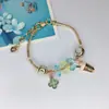 Pulsera Elegante de Aleación Galvanizada con Broche de Langosta y Trébol de Cuatro Hojas para Mujer, Más Vendida en el Sudeste Asiático, Joyería de Dibujos Animados en Stock, Hecha a Mano