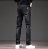 Jeans de Sarja Masculino para Atacado Primavera e Outono Marca da Moda Calças Casuais Retas Largas Moda Calças Masculinas Lavadas em Água Elásticas Versáteis Calças Compridas