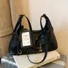 Bolso de axila retro de gran capacidad transfronterizo para mujer, nuevo bolso tote simple 2026, bolso versátil de hombro y cruzado para el día a día