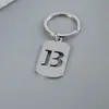 Venta Caliente de Productos Nuevos Transfronterizos 26 Letras Inglesas Huecas de Acero de Titanio Sin Decoloración Accesorios de Joyería Llavero 26 Letras
