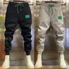 Verano 2023 nuevos pantalones casuales de malla para hombre, combinan con todo, con cordón en el tobillo, pantalones deportivos, marca de moda, pantalones de chándal para jóvenes