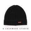 Un gorro de cachemira 100 pura para hombres y mujeres con protección acolchada para las orejas para otoño e invierno, gorro de punto cálido para amantes