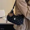 Bolso bandolera, bolso coreano de lunares de nicho, modelo nuevo, bolso de gamuza ligero de lujo para el hombro y la axila para mujer, Crescent 2026