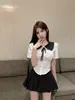 Uniforme jk Estilo Preppy Novo 2025 Camisa de Manga Curta com Gola Boneca Efeito Emagrecedor Saia Plissada de Cintura Alta Versátil Conjunto