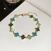 [Cadena de Diamantes Arcoíris] Pulsera de extracción de zircón trenzado en cruz, una pulsera lujosa y de alta gama, una pieza de joyería delicada y de moda
