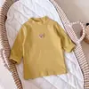 Camiseta básica de manga larga de color liso para bebé, unisex, cuello medio alto, prenda interior cálida, ropa de oso de dibujos animados estilo coreano