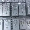 Loja de 2 yuans Conjunto de colar com corrente para clavícula, anel e brincos femininos, terno de combinação, pequeno presente, joias para estudantes