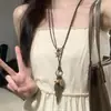 Colar com Pingente de Sapato de Laço Estilo Ballet para Mulheres Design de Nicho Corrente Longa para Suéter Puxável Acessórios