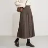 Falda plisada transfronteriza para mujer, otoño e invierno, poliéster de alta elasticidad, cintura elástica, color liso, longitud media, línea A fluida, versátil