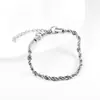 Pulsera de acero de titanio con giro ins europeo y americano tendencia hip-hop para hombres y mujeres parejas cadena lisa simple versátil joyería de moda al por mayor