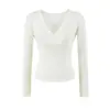 Camiseta rosa de manga larga con cuello cruzado para mujer, adecuada para principios de otoño, con diseño entallado a la cintura, elegante y versátil, top corto