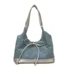 Bolsa de axila de grande capacidade para o dia a dia de mulheres, novo modelo primavera/verão 2026, bolsa tote jeans casual com detalhe de laço