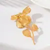Broche largo floral de cuatro pétalos con textura vintage transfronterizo en oro mate, diseño de hoja y flor, sensación de alta gama, al por mayor