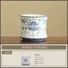 Tazas de té plateadas y azules pintadas a mano con diseño de loto, incluyendo una taza maestra y una taza con junta de bambú, un juego de exquisita vajilla de cerámica para té y una caja de regalo para degustación de té