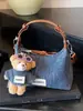 Bolso de mezclilla exquisito y moderno de nicho para mujer, nuevo bolso cruzado versátil de moda 2025, bolso de mano pequeño para salidas