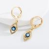 Pendientes de moda exquisitos y exagerados con microincrustaciones de circonitas chapadas en oro y cobre personalizados de estilo europeo y americano con forma de ojo de diablo