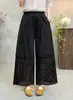 Estilo nuevo de verano estilo chica Mori artístico cintura elástica color liso diseño de retazos huecos pantalones rectos holgados versátiles al por mayor
