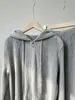 Novo conjunto de moletom outono/inverno da Miyake para mulheres, um conjunto de duas peças de alta qualidade apresentando um top com capuz e calças plissadas, completo com um visual coordenado