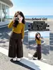 Pantalones de pierna ancha para niña Otoño 2026 Moda Nueva para Bebé Niña Dos en Uno Pantalones Casuales Pantalones a Cuadros para Niños Estilo Despeinado Hacia Atrás Modernos