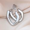 Europa y Estados Unidos arete de titanio y acero redondo hidráulico transfronterizo aretes de chapado de alta gama para mujer multiestilo en stock suministro directo de fábrica