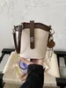 Bolso Cubo Retro de Bloques de Color de Moda con Cierre de Giro para Mujer 2025 Nueva Moda de Primavera Bolso de Hombro Cruzado Patchwork de Nicho