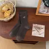 Calcetines bordados de dibujos animados para mujer, otoño e invierno, estilo preppy, de longitud media hasta la pantorrilla, estilo japonés con bordes enrollados, con lindos diseños de letras y cachorros, sin costuras y afelpados