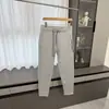 ¡Estilo de pierna cónica! ¡Tejido Toray de capa de aire! Moda masculina otoño e invierno color liso cremallera versátil hoja curva pantalones casuales