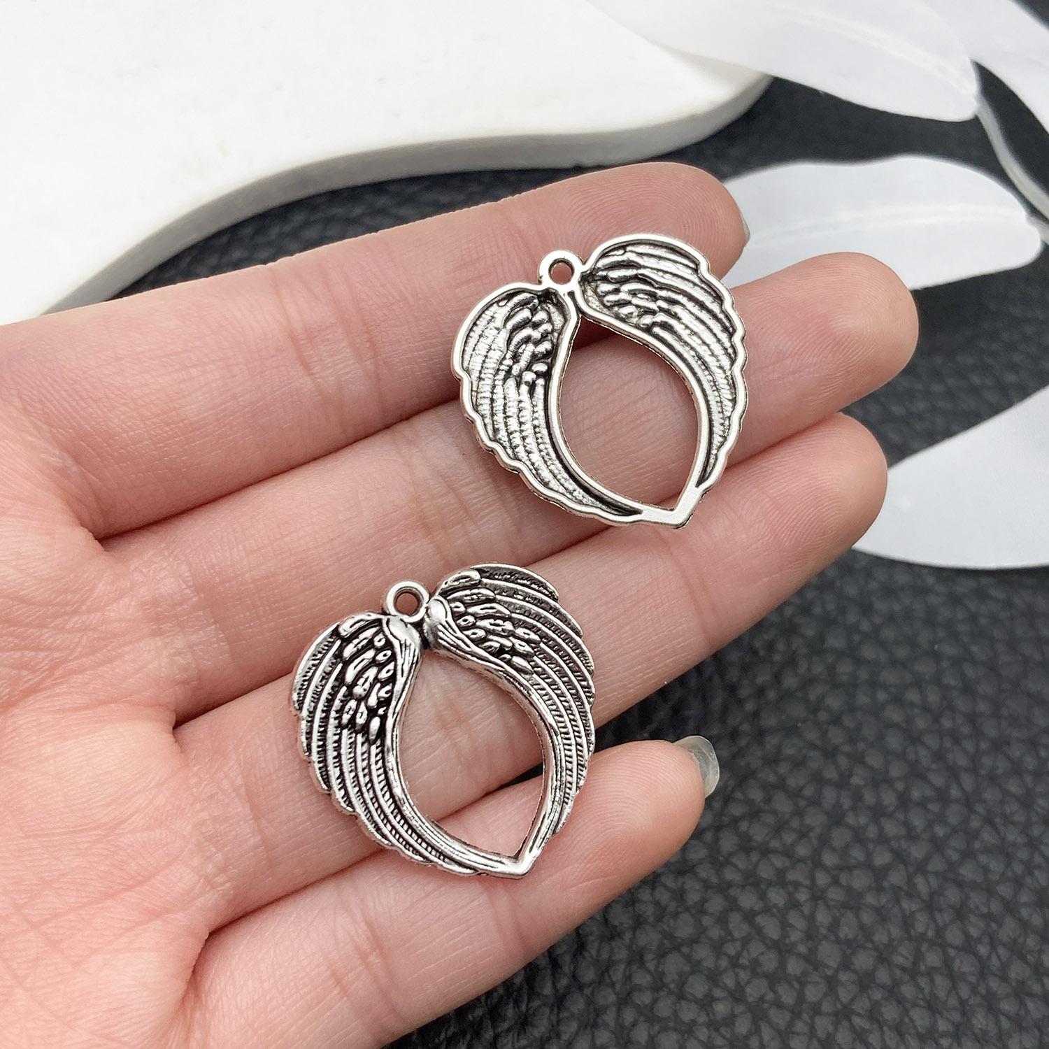 21423-X-古银锌合金心形翅膀25x24mm-2.1g