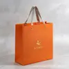 Bolsa de tote de papel recubierto impresión de LOGOTIPO personalizado fabricante venta al por mayor naranja bolsa de regalo bolsa de compras impresión personalizada
