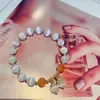 Lugar escénico el más vendido una generación de pulsera Ojo de Gato Blanco ins simple Joker fábrica al por mayor