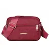 Nova bolsa feminina de ombro único para a primavera, bolsa transversal para celular e moedas para o dia a dia, estilo horizontal em tecido de nylon com quatro zíperes, bolsa de ombro feminina