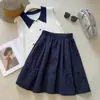 Falda midi color caqui estilo colegial 2026 Primavera/Verano Nuevo Diseño Reductora de Edad Estilo Japonés Bolsillo Falda de Línea A Coreana