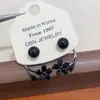 Pendientes de Doble Uso Florales Negros de Gama Alta con Diseño de Nicho, Pendientes Versátiles y Elegantes de Lujo Ligero, Nuevos Accesorios para Orejas de Moda 2025