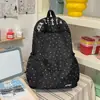 Mochila com padrão de ondas azul leitoso, estilo claro e artístico, estilo coreano, suave e versátil, adequada para viagens e passeios, faz o usuário parecer mais claro.